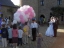 Wedding couple look at the clown and children preparing the release of balloons
