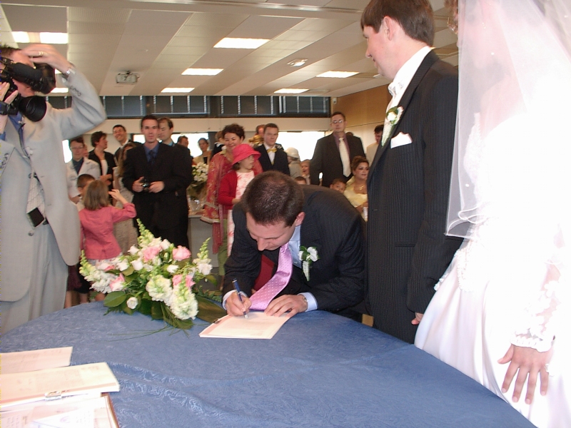 Best man signs official wedding papers